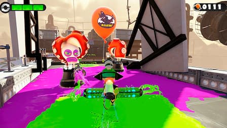 An Inkling rolls forward against two Octarian enemies